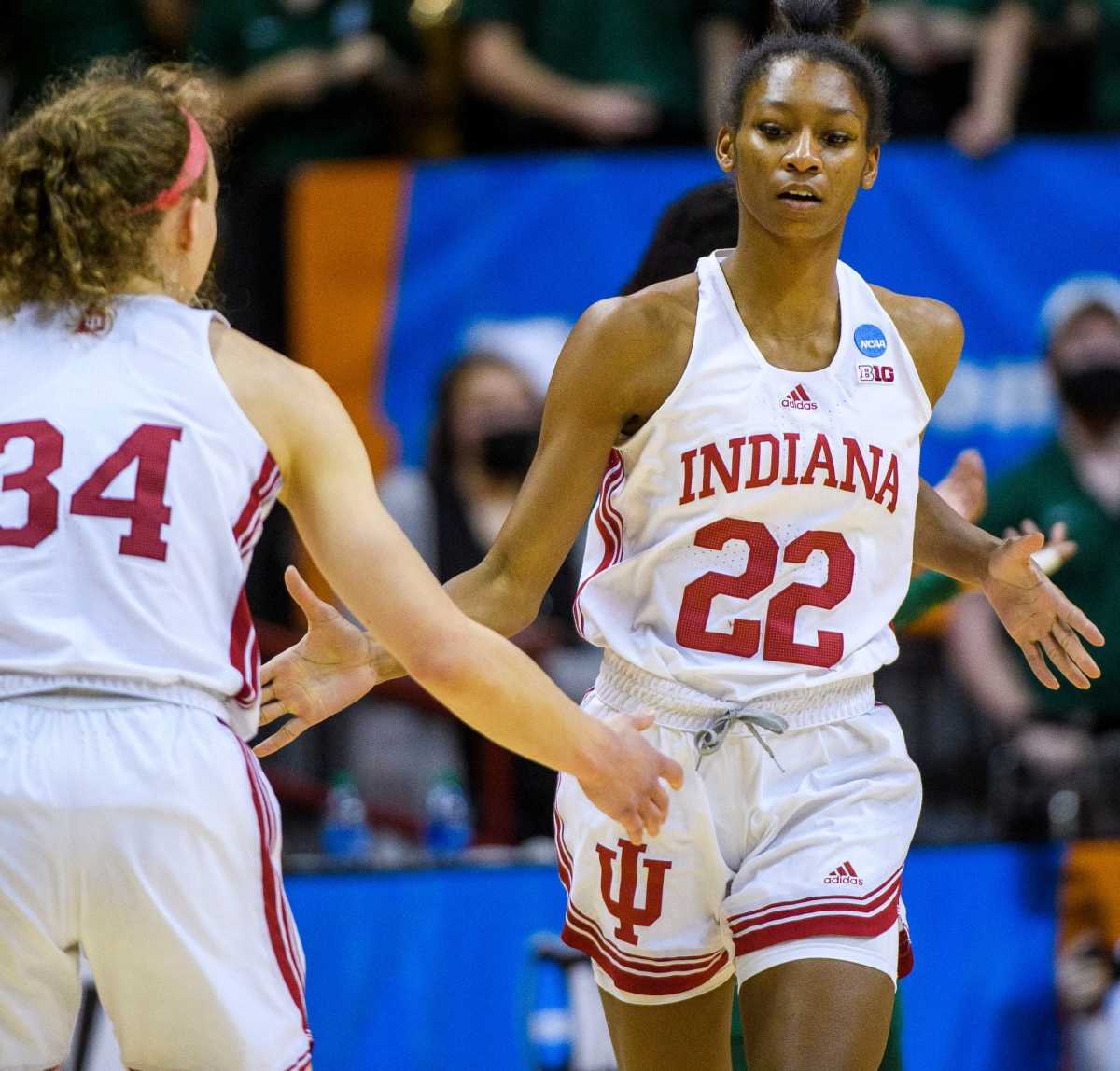 Grace Berger high fives Chloe Moore-McNeil.